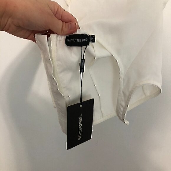 NEW NWT PRETTYLITTLETHING Woven Cross Front Cutout Stirrup Hem Top Cream Ivory 8 - Picture 7 of 12